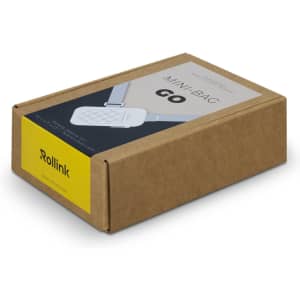 A brown cardboard box containing a compact, white product with a logo, labelled "Mini Bag Go".