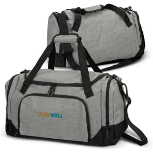 A grey duffle bag with black accents featuring a logo, detailed with dual handles and an adjustable shoulder strap.