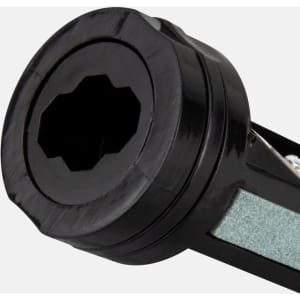 A black carpenter's pencil sharpener with a multi-faceted opening for sharpening pencils. It features a sleek design.