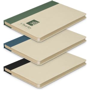 Three notebooks stacked together in cream, blue, green, and black colours, featuring a branding logo on one.