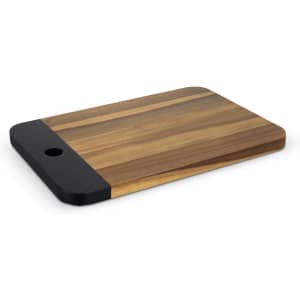 A wooden serving board in natural tones with a black accent, featuring a rounded corner and a hole.