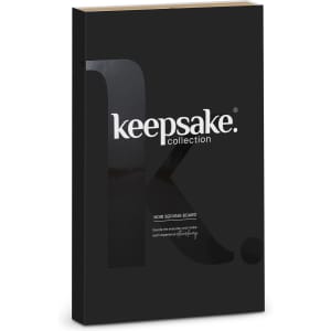 A black box featuring the Keepsake Noir Serving Board, with minimalist branding on the front.