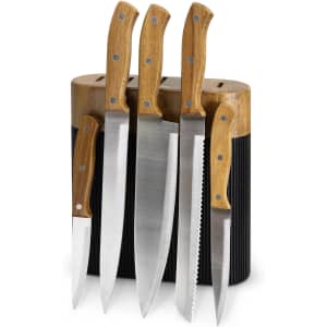 A knife block featuring four stainless steel knives with wooden handles, set in a stylish black and natural wood holder.
