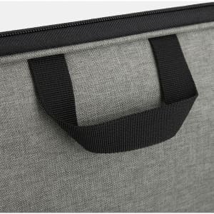 A grey satchel with a black handle, featuring a textured fabric and zipper closure. It has a logo on the material.