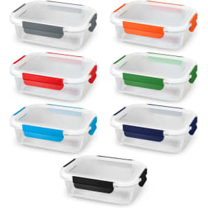 A set of glass lunch boxes with colourful silicone clips in grey, orange, green, blue, and navy. Each box is transparent.
