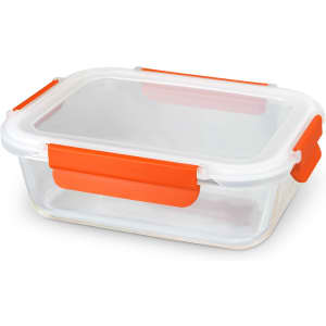 A transparent glass lunch box with orange clips on the sides and a clear lid.