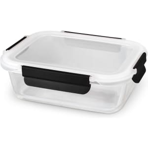 A rectangular glass lunch box with a white lid and black clips, featuring a transparent body.