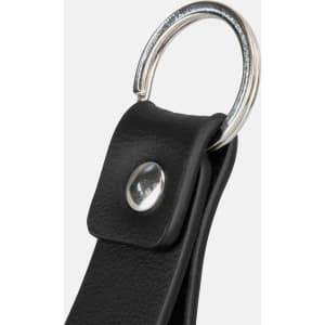 A black leather key ring with a silver metal loop and snap button detail.