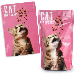 A pink foil stand-up pouch containing cat treats, featuring a graphic of a cat with treats above it and a logo.