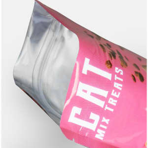 A pink foil stand-up pouch with an angled opening, featuring a clear section and a logo.