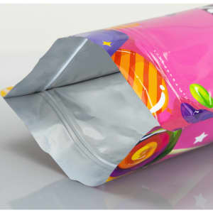 A medium-sized foil stand-up pouch in vibrant pink with colourful graphics and a silver interior.