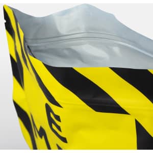 A large foil flat bottom pouch with a striking yellow colour and a black graphic design, featuring a zippered top and a logo.