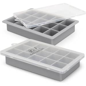 A grey ice tray with a lid featuring 12 compartments, designed for making ice cubes. It includes a logo on the front.