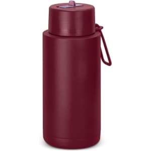 A drink bottle in burgundy, featuring a lid with a straw and a carrying loop. It has a logo on the side.