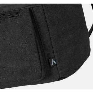A black canvas cooler bag with a zipped pocket and a subtle logo on the side.