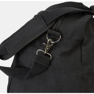 A black canvas duffle bag featuring a zipper and adjustable shoulder strap with a metal clasp.
