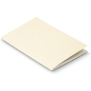 A soft cover notebook in a cream colour with visible speckles and a simple design. It features a logo on the front.
