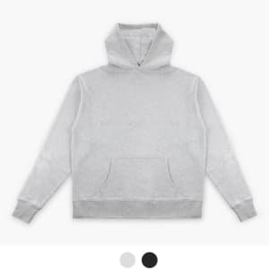 A light grey essential hoodie with a front pocket and a drawstring hood, featuring a logo on the chest.