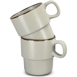 A set of two stackable coffee mugs in light grey with a brown rim, featuring a simple design and a handle.