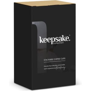 A black box containing a set of two stackable coffee cups. The product features a logo.