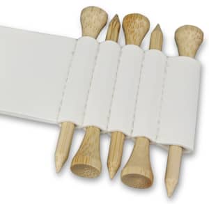 A white golf tee holder contains five bamboo golf tees in varying shapes.