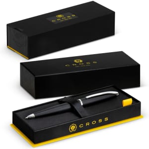 A black ballpoint pen with a silver clip and yellow accents, presented in a black and yellow branded box.