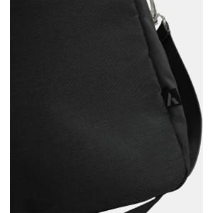 A black duffle bag with a subtle texture and an attachment point for a strap, featuring a small logo.