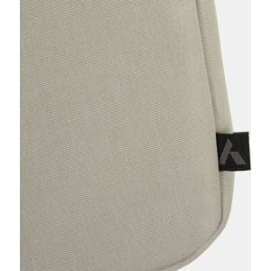 A beige laptop bag with a textured fabric, featuring a small logo tag on the side.