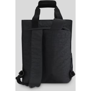 A black tote pack with adjustable straps and a structured design, featuring a front zip pocket and a top handle.