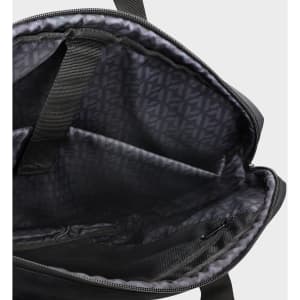 An interior view of a black laptop bag featuring multiple compartments and a patterned lining.