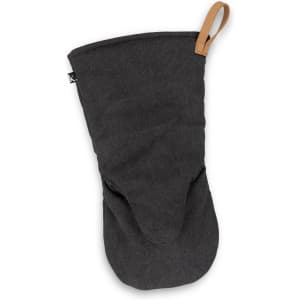 A dark grey canvas oven mitt with a leather loop for hanging and a logo on the side.