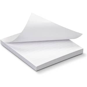 A stack of white recycled sticky pads, measuring 70 x 75mm, featuring 50 sheets with a corner sheet lifted.