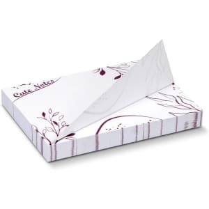 A white sticky pad featuring floral designs, measuring 100 x 75mm with 100 sheets. Includes branding on the cover.