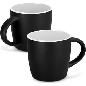 A set of two black coffee mugs with a white interior and contrasting rim, featuring handles and a simple design.