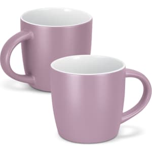 Two pink coffee mugs with a smooth matte finish and white interiors. Both feature a rounded shape and sturdy handles.