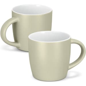 A mocha coffee mug in a soft beige colour with a white interior and a curved handle. Two mugs are displayed.