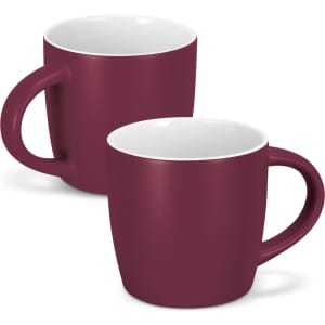 A set of two mocha coffee mugs in a rich burgundy colour with a white interior and a simple handle design.