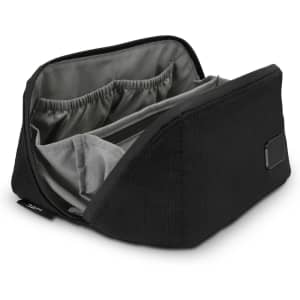 A black toiletry bag with a spacious interior and organisational pockets, featuring a sleek design.