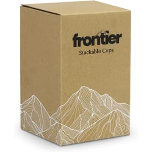 A brown box containing two stackable cups, featuring a mountain design and a logo on the front.