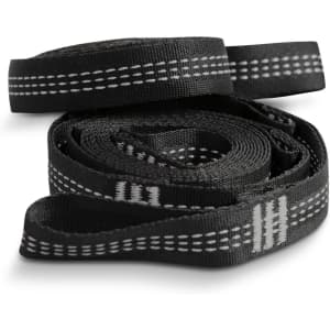 A set of black straps featuring white stitching patterns, coiled neatly together. The straps have a logo visible.