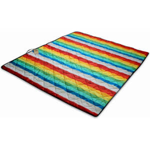 A brightly coloured picnic blanket featuring a quilted design with rainbow stripes in red, blue, yellow, and white.