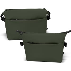 A soft-touch, olive green toiletry bag featuring multiple compartments and a logo.
