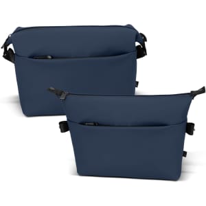 A navy soft-touch toiletry bag with two compartments and a logo, featuring front pockets and adjustable straps.