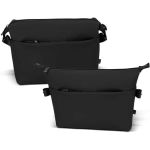 A black soft-touch toiletry bag featuring multiple compartments and a sleek design with an adjustable strap.