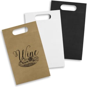A set of three die cut paper wine bags in brown, white, and black with one featuring a wine graphic and handle.
