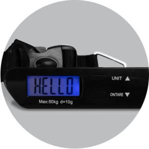 A travel luggage scale in black with a blue LCD display and a digital readout, featuring a strap and a clip.
