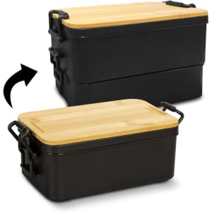 An expandable black lunch box with a bamboo lid, featuring a logo and clip closures on the side.