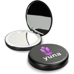 A compact mirror with a black exterior and a reflective interior, featuring a logo on the lid.