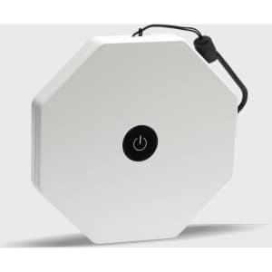 A white octagonal foldable lantern with a power button and a strap for easy carrying.