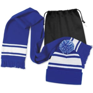 A blue scarf and beanie with pom pom, featuring white stripes, packaged in a black drawstring bag.
